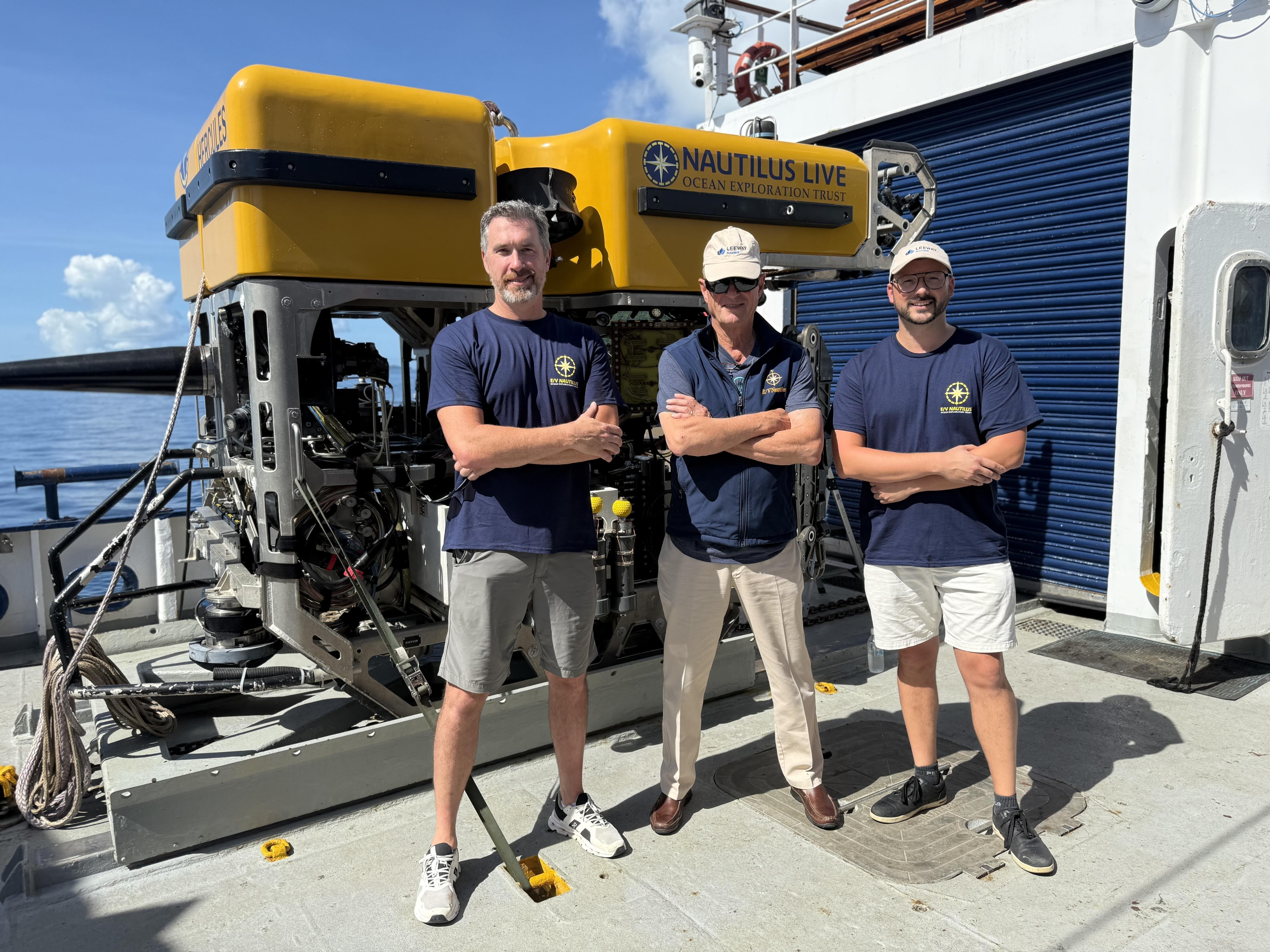 Bill Sanson, President, Leeway Marine (left), and Greg Veinott, Vice President, Leeway Marine (right) onboard E/V Nautilus with Dr. Robert Ballard, President, Ocean Exploration Trust, in November 2024.